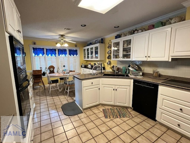 kitchen featuring black appliances, white cabinets, ceiling fan, ornamental molding, and light tile patterned floors