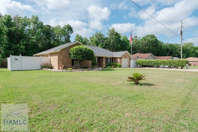 ranch-style home with fence, a front lawn, an attached garage, and brick siding