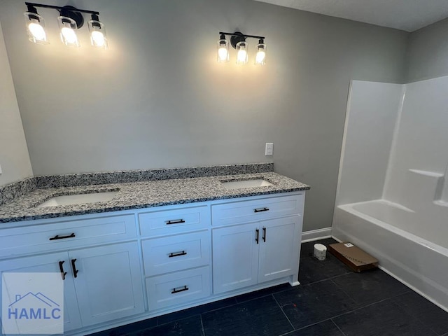 556 Caleb Cir, Jesup, GA 31545 - bathroom featuring tile patterned flooring, double vanity, and shower / tub combination