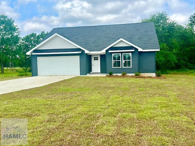 556 Caleb Cir, Jesup, GA 31545 - view of front facade featuring a shingled roof, driveway, an attached garage, and a front lawn