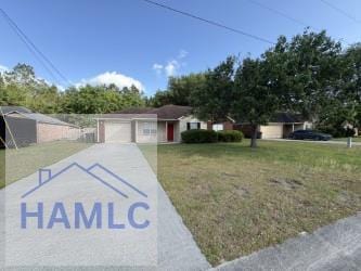 ranch-style home with a garage, driveway, and a front yard