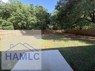 view of yard with fence