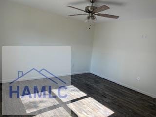 unfurnished room with wood finished floors, a ceiling fan, and baseboards