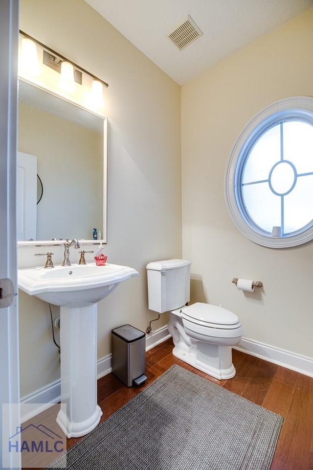 bathroom with toilet and sink