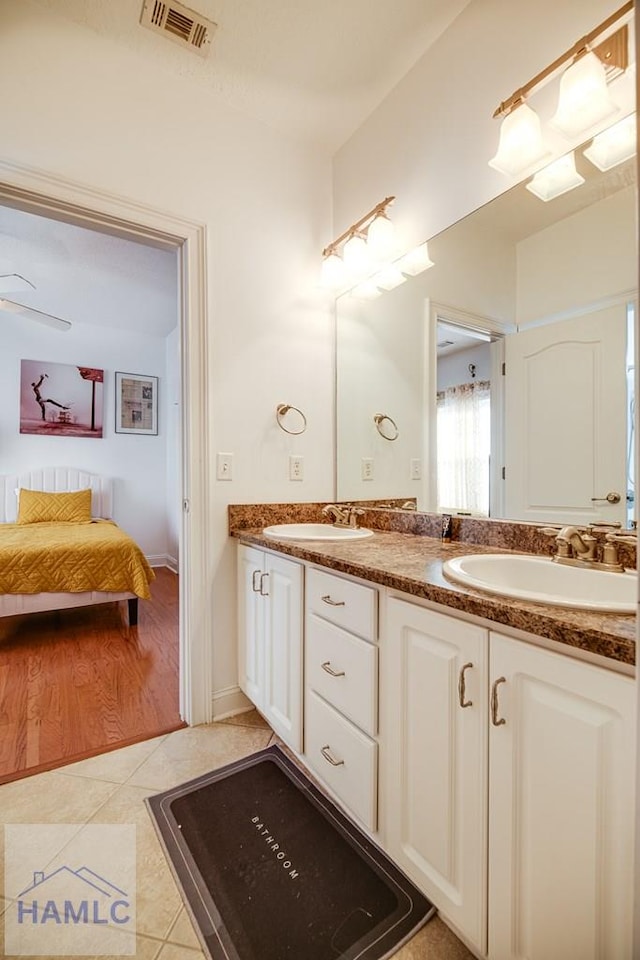 bathroom featuring tile patterned floors, ceiling fan, and vanity