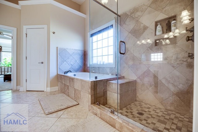 bathroom with tile patterned flooring, independent shower and bath, and ornamental molding