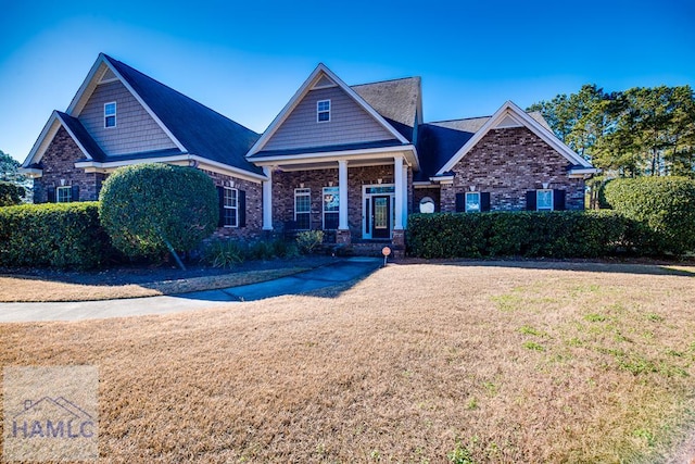 craftsman house featuring a front yard