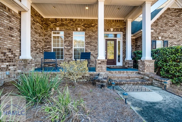 property entrance with covered porch