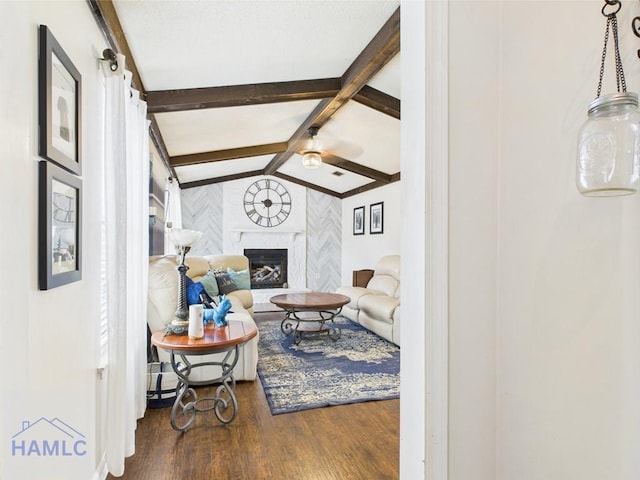 living room featuring wood finished floors and a fireplace