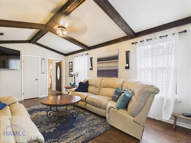 living area featuring baseboards, wood finished floors, and a ceiling fan
