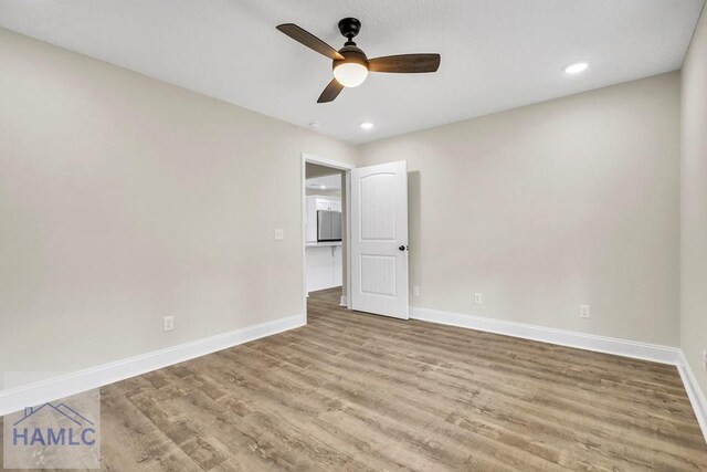 interior space featuring ceiling fan and light wood-type flooring