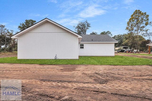 view of property exterior featuring a lawn