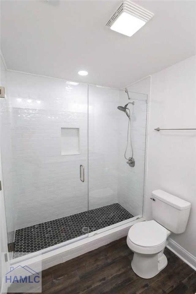 210 Sugar Maple St, Jesup, GA 31546 - full bath with toilet, a stall shower, wood finished floors, and recessed lighting