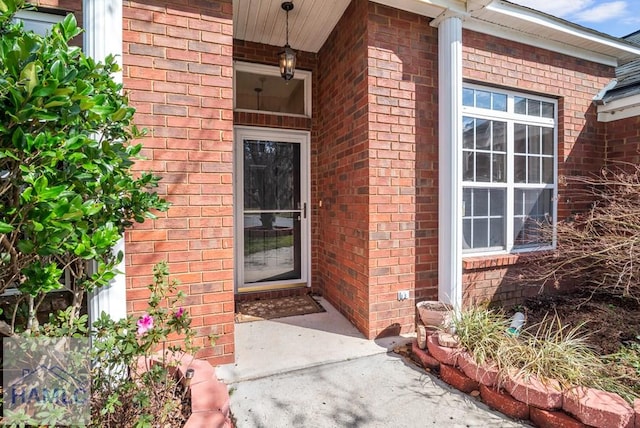 property entrance with brick siding