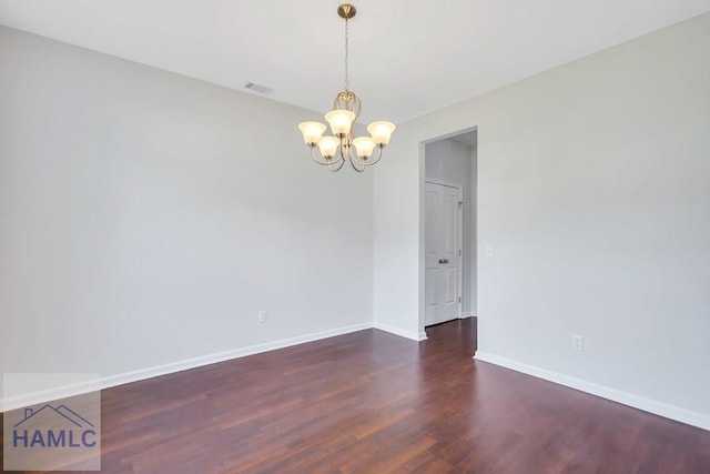 89 Morgan Field Blvd, Ludowici, GA 31316 - unfurnished room featuring a chandelier, wood finished floors, and baseboards