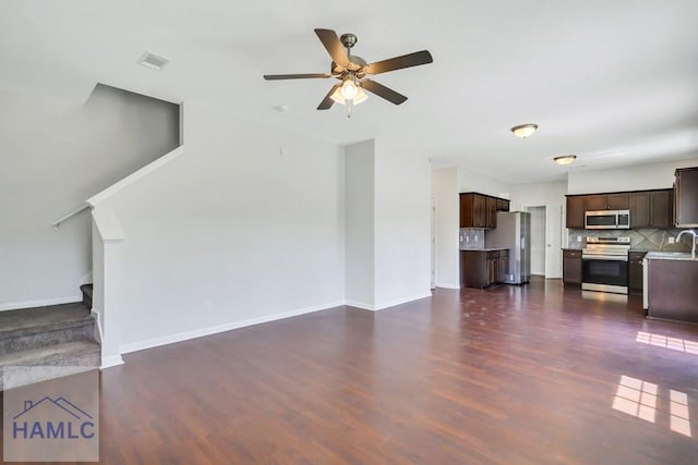89 Morgan Field Blvd, Ludowici, GA 31316 - unfurnished living room with dark wood-style flooring, a ceiling fan, and baseboards