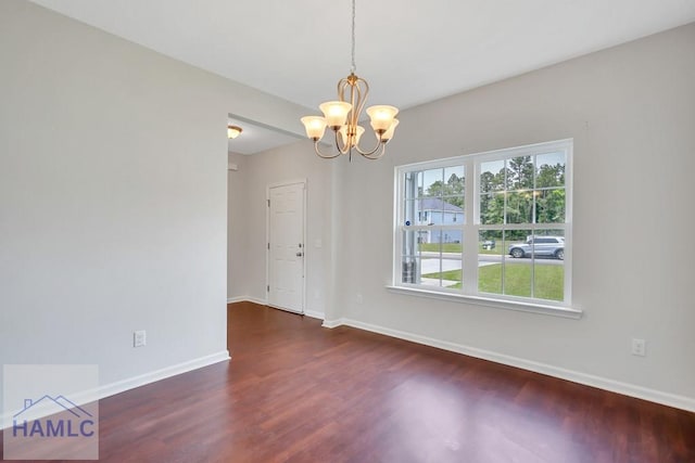 89 Morgan Field Blvd, Ludowici, GA 31316 - unfurnished room featuring wood finished floors, baseboards, and a chandelier