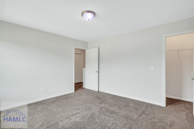 89 Morgan Field Blvd, Ludowici, GA 31316 - unfurnished bedroom featuring carpet, a spacious closet, baseboards, and a closet