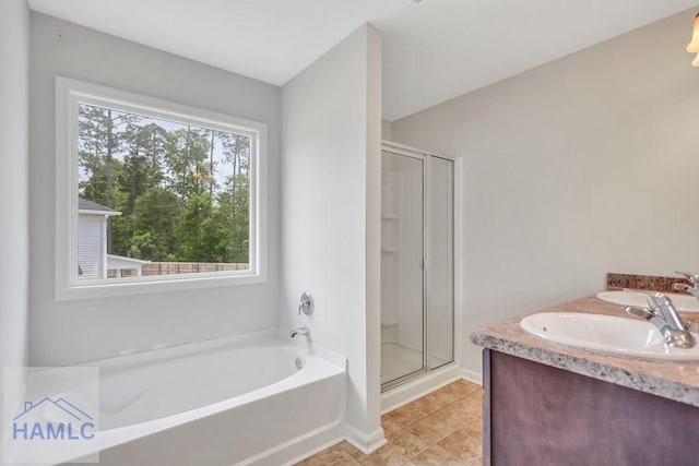 89 Morgan Field Blvd, Ludowici, GA 31316 - bathroom with a bath, a stall shower, tile patterned floors, and double vanity