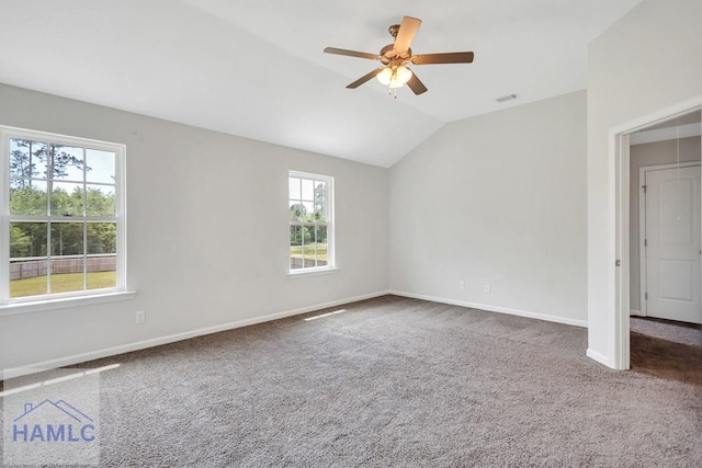 89 Morgan Field Blvd, Ludowici, GA 31316 - empty room featuring healthy amount of natural light, carpet flooring, lofted ceiling, a ceiling fan, and baseboards