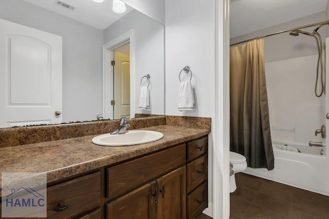 243 Forest St, Ludowici, GA 31316 - full bathroom featuring shower / bath combination with curtain, visible vents, tile patterned flooring, vanity, and toilet