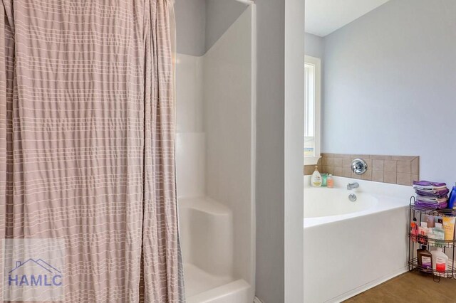 243 Forest St, Ludowici, GA 31316 - bathroom with a shower with curtain and a garden tub