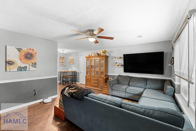 124 Deann Dr, Hinesville, GA 31313 - living room featuring a ceiling fan, wood finished floors, and baseboards