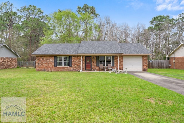 124 Deann Dr, Hinesville, GA 31313 - single story home featuring an attached garage, driveway, brick siding, and covered porch