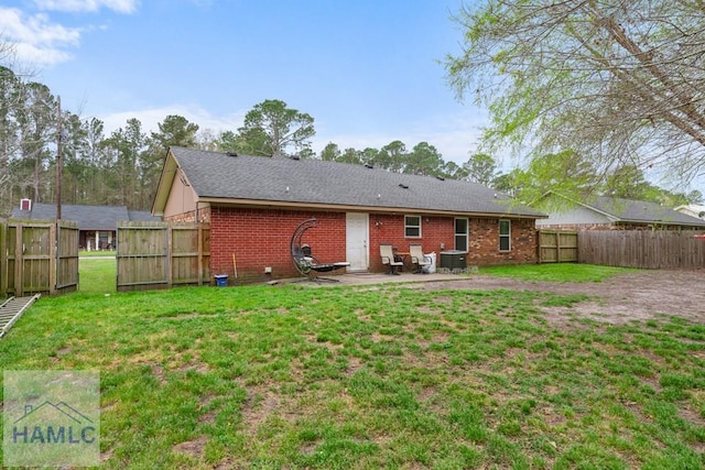 124 Deann Dr, Hinesville, GA 31313 - rear view of house featuring brick siding and a patio area