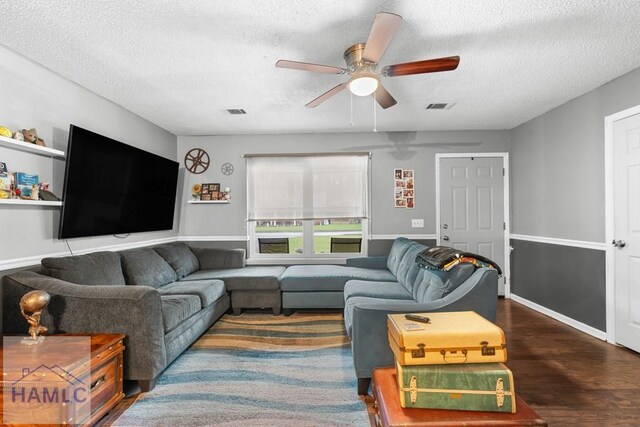 124 Deann Dr, Hinesville, GA 31313 - living area featuring a textured ceiling, ceiling fan, and wood finished floors