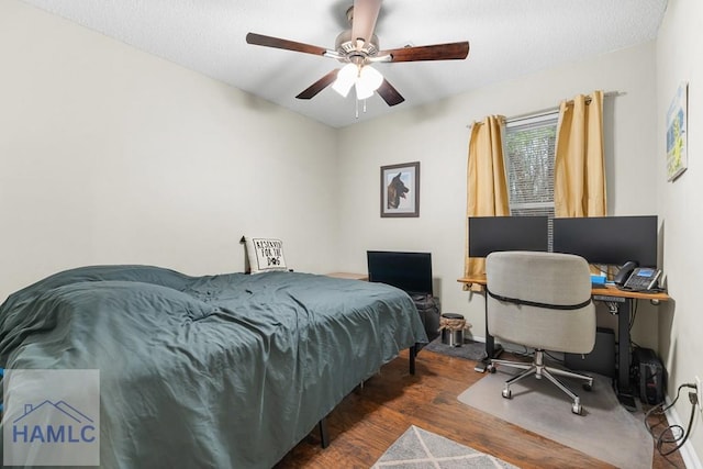124 Deann Dr, Hinesville, GA 31313 - bedroom with wood finished floors, a ceiling fan, a desk, and baseboards