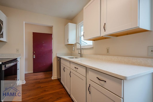 727S Main St Unit 121, Hinesville, GA 31313 - kitchen featuring dark wood finished floors, white cabinets, light countertops, and stainless steel electric range oven