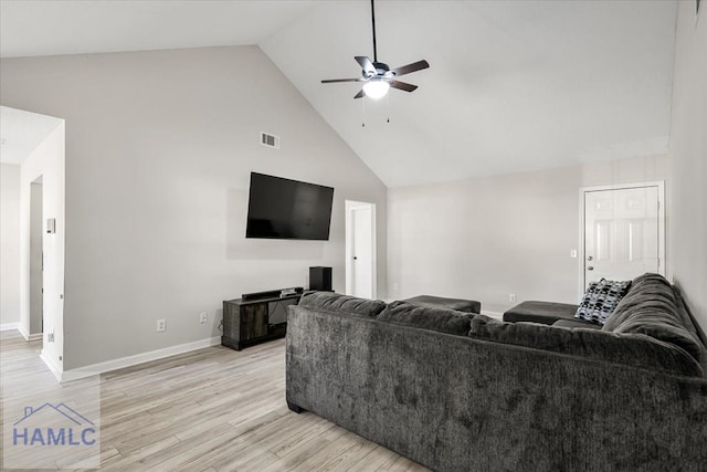 living room featuring light wood-type flooring, high vaulted ceiling, and ceiling fan