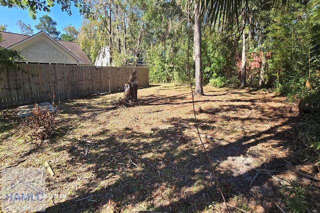view of yard with fence