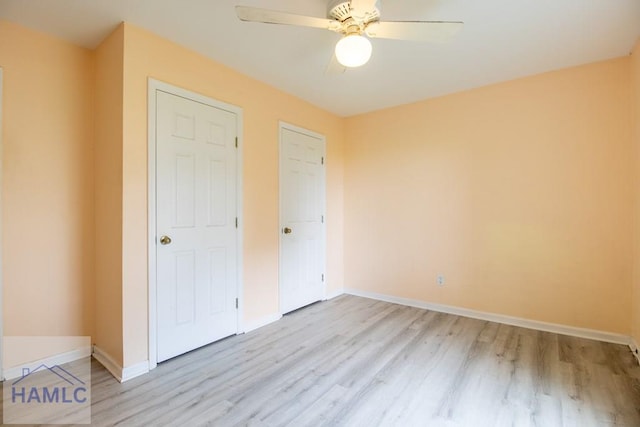 unfurnished bedroom featuring ceiling fan and light hardwood / wood-style floors