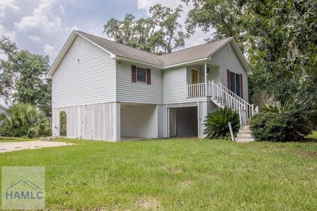 view of home's exterior with a lawn and covered porch