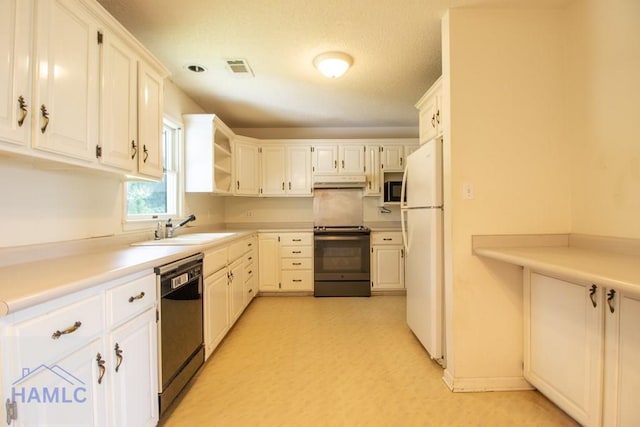 kitchen featuring sink, white cabinetry, and black appliances