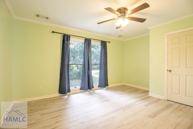 unfurnished room featuring ceiling fan, ornamental molding, and light wood-type flooring