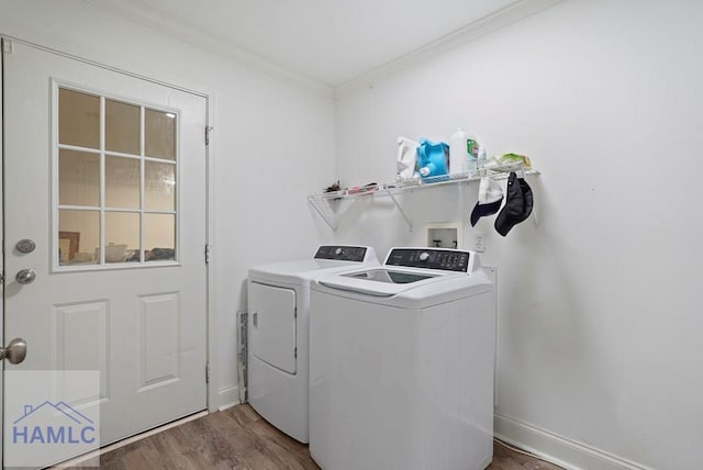 550 Brogdon Rd, Guyton, GA 31312 - laundry area featuring washing machine and clothes dryer, crown molding, wood finished floors, and baseboards