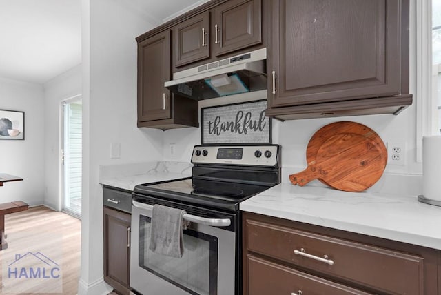 550 Brogdon Rd, Guyton, GA 31312 - kitchen with stainless steel range with electric stovetop, under cabinet range hood, dark brown cabinets, crown molding, and light wood-style flooring