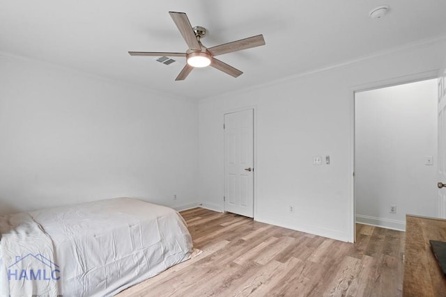 550 Brogdon Rd, Guyton, GA 31312 - unfurnished bedroom with ornamental molding, wood finished floors, baseboards, and ceiling fan