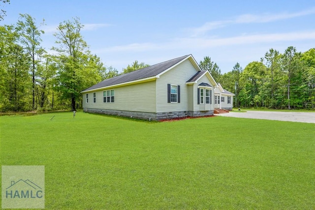 550 Brogdon Rd, Guyton, GA 31312 - view of property exterior with a lawn, concrete driveway, and crawl space
