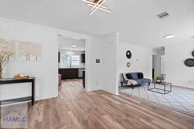 550 Brogdon Rd, Guyton, GA 31312 - living area with light wood-style floors, ornamental molding, and baseboards