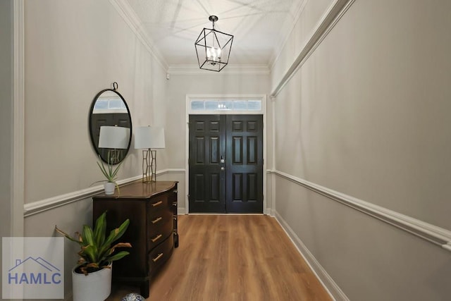 645 Littlefield St, Jesup, GA 31546 - entrance foyer with a chandelier, ornamental molding, and wood finished floors
