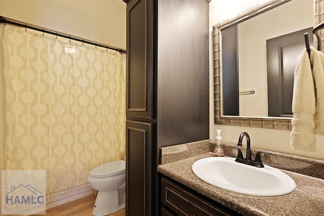 645 Littlefield St, Jesup, GA 31546 - full bathroom featuring vanity and wood finished floors