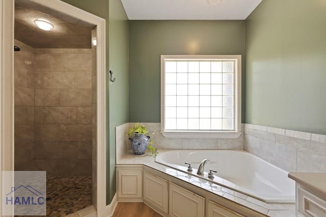 645 Littlefield St, Jesup, GA 31546 - bathroom featuring a bath and a tile shower