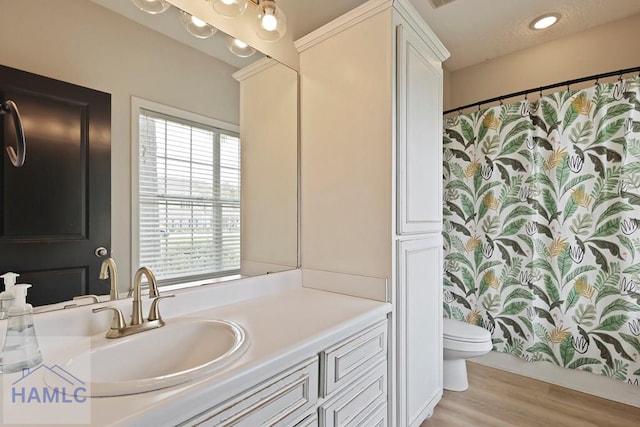 645 Littlefield St, Jesup, GA 31546 - bathroom with vanity, wood finished floors, and curtained shower