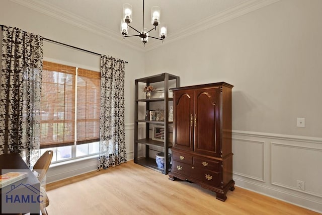 645 Littlefield St, Jesup, GA 31546 - office area featuring a chandelier, light wood finished floors, crown molding, healthy amount of natural light, and wainscoting