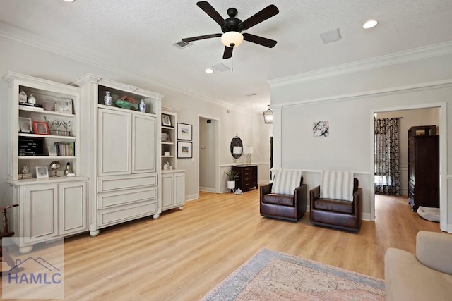 645 Littlefield St, Jesup, GA 31546 - living area featuring crown molding, a ceiling fan, light wood-style flooring, recessed lighting, and a textured ceiling