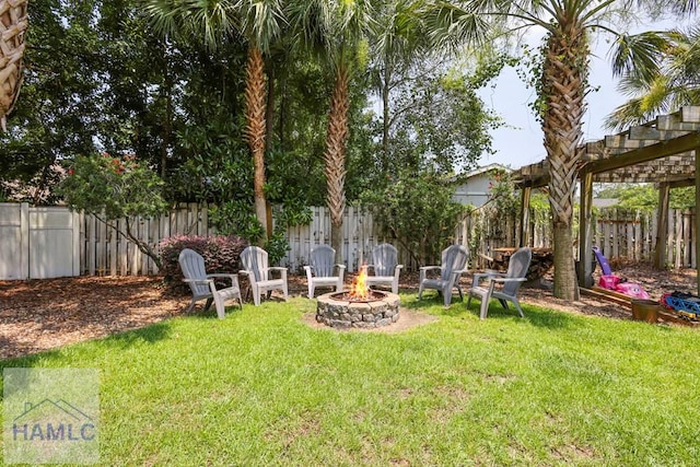 645 Littlefield St, Jesup, GA 31546 - fenced backyard featuring a fire pit